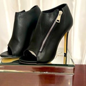 Never worn. Open Toe , size 8 black , 4.5 inch high heeled bootie with zipper.